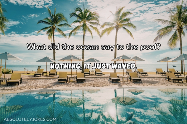swimming pool surrounded by lounge chairs and umbrellas, with a view of the ocean, with joke overlay