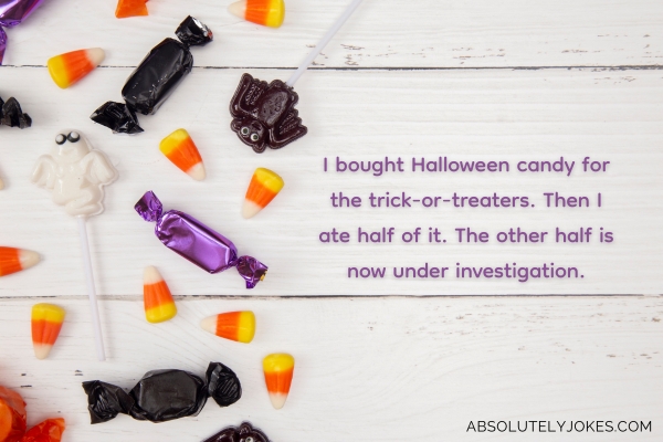 halloween candies on white wood, with joke overlay